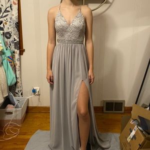 V-neck full length Silver prom dress with leg slit. Size small.